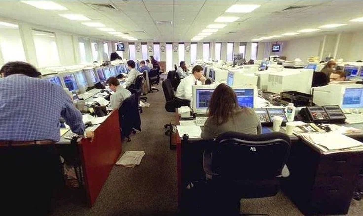 Figure 28. (1990s-2001) Typical WTC office interior showing standard office contents including desks, chairs, telephones, filing cabinets, and other durable furnishings that would be expected to remain as macroscopic fragments after collapse.
  <br>
  - Photo by Konstantin Petrov