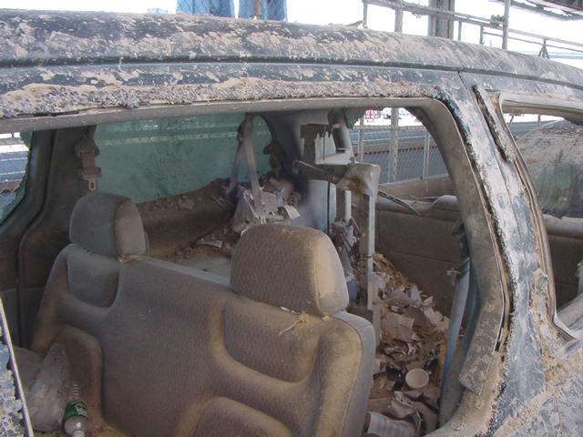 Figure 52. (9/13/01) Vehicle showing anomalous rapid oxidation of exterior while unburnt seatbelts, upholstery, and plastic molding remain intact, demonstrating dielectric survival versus conductive failure
