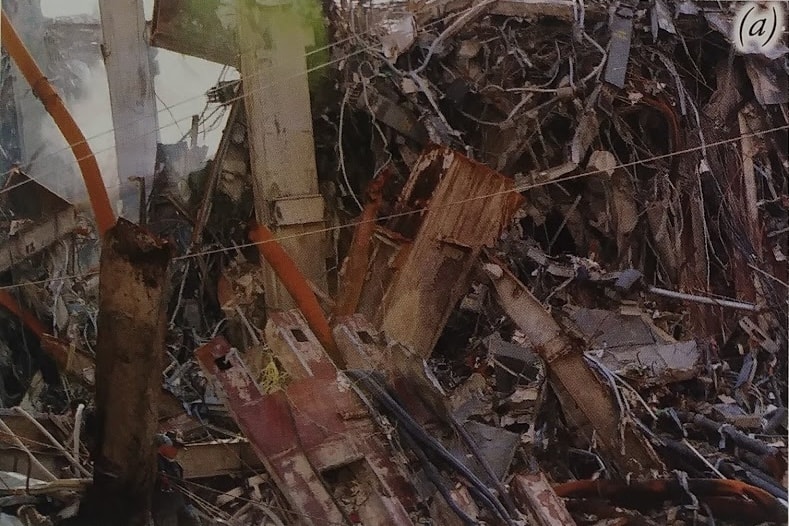 Figure 70. (9/16/01) Uniform rusted beams and pipes. Steel pipe or beam showing bright orange granular oxide with hyper-accelerated oxidation, demonstrating anomalous oxide propagation. - Photo by FEMA , (cropped from original, intensity adjusted)