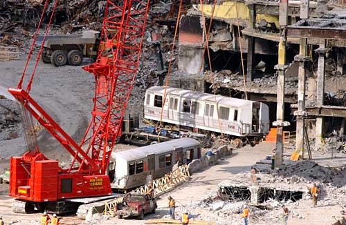 Figure 112. (2/22/02) Seven PATH Train cars which were parked in the PATH station under WTC were not crushed and were lifted from the bathtub. PATH cars 745 and 143 were carefully extracted from the sub-basements beneath the World Trade Center site.\<br>- Image by PATH (Port Authority Trans Hudson)