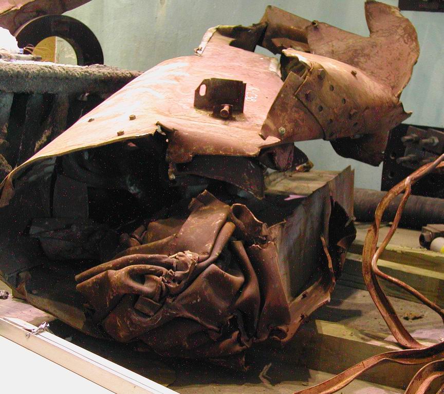 Figure 36. Perimeter column assembly showing three columns and spandrel plates wrapped in tight spiral with concentric helical winding around column axis
  <br>
  - Image by NIST