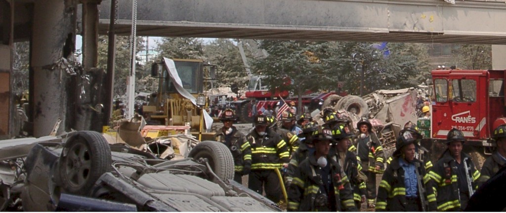 Figure 54. Flipped cars and fire trucks (rig) near the Liberty and West Street intersection, while in the near vicinity of trees with full foliage still intact, demonstrating dielectrophoretic levitation without collateral aerodynamic damage