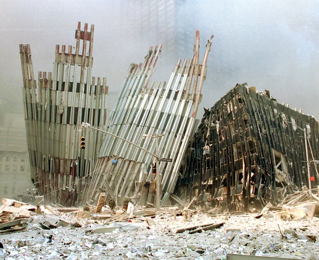 Figure 43. WTC Perimeter beams stabbed into Church Street, 400 feet away from WTC2. Window panel from 77th floor of south tower showing survival of projectile with minimal deformation, demonstrating impedance matching