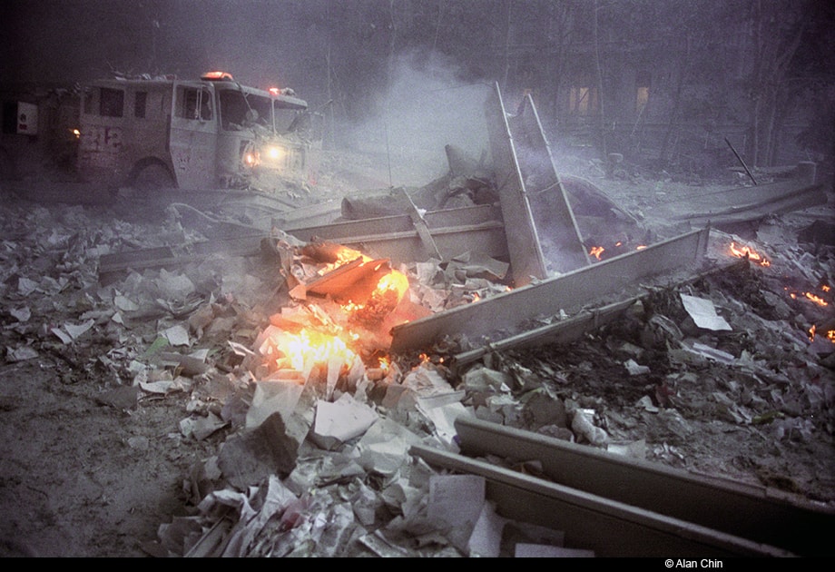 Figure 64. (9/11/01) Aluminum cladding and debris on ground exhibiting glow without burning adjacent materials, showing non-incandescent luminosity.<br>- Photo by ALan Chin