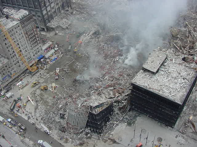 Figure 28. (??/??/01) WTC4 showing main body completely missing with thin wing remaining standing, demonstrating clean vertical planar cut and field-boundary truncation