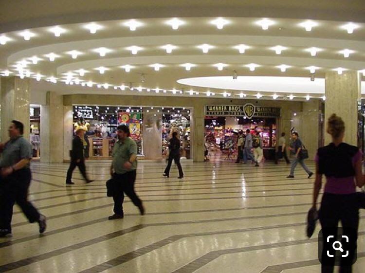Warner Brothers Studio Store in subgrade concourse showing fragile ceramic and plastic merchandise remaining upright and undamaged on shelves