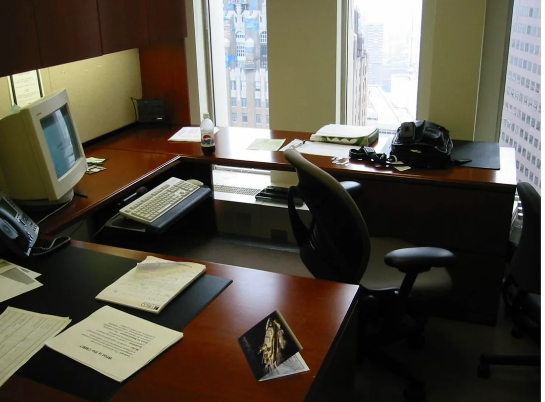 Figure 29. (08/22/01) Typical WTC office interior showing standard office contents including desks, chairs, telephones, filing cabinets, and other durable furnishings that would be expected to remain as macroscopic fragments after collapse. Under this audit framing, the reported scarcity of recognizable contents post-event is treated as consistent with material-selective coupling and/or elevated fines production rather than simple kinetic crushing alone, absent additional burial/export assumptions.