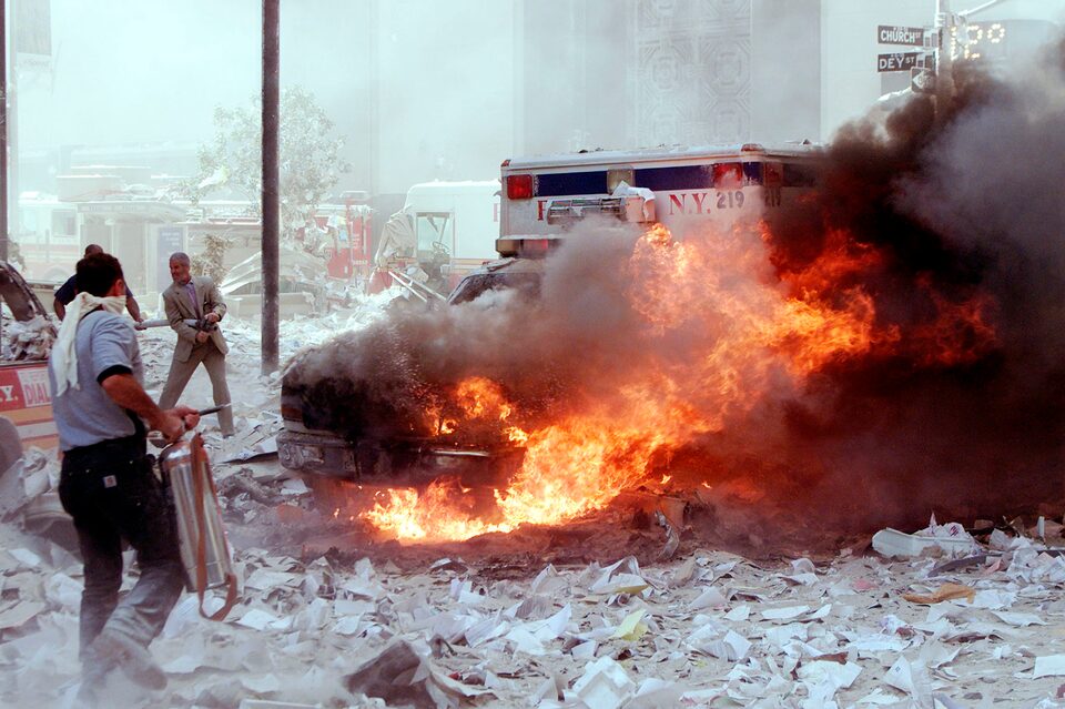 Figure 49. (9/11/01) Vehicle at street level showing fire damage despite being 1000+ feet below the event origin, consistent with interferometric node coupling (side-lobe analogue). Unburnt paper adjacent to the vehicle.