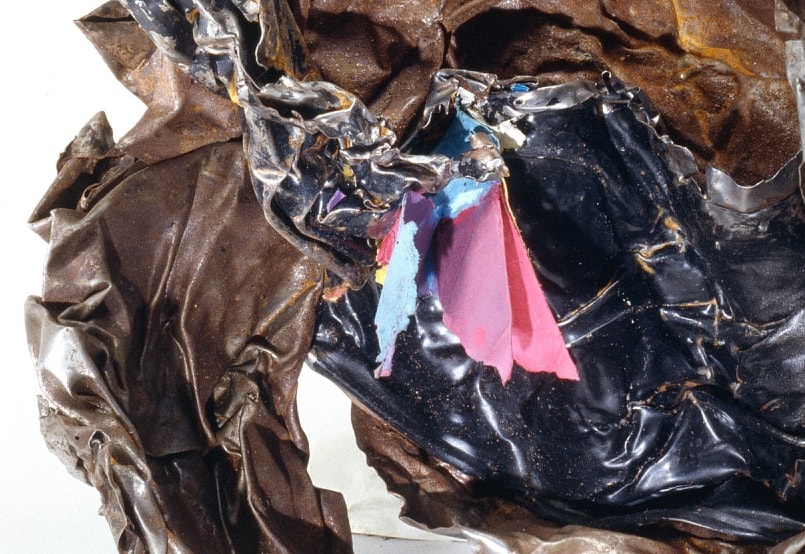 Figure 31. Close-up of the File Cabinet from a Ben & Jerry's ice-cream shop under the WTC complex. The paper retained its color, indicating this file cabinet did not shrivel due to conventional heat. Close-up view of filing cabinet artifact showing paper documents embedded in steel matrix, demonstrating athermal interface bonding without cellulose pyrolysis