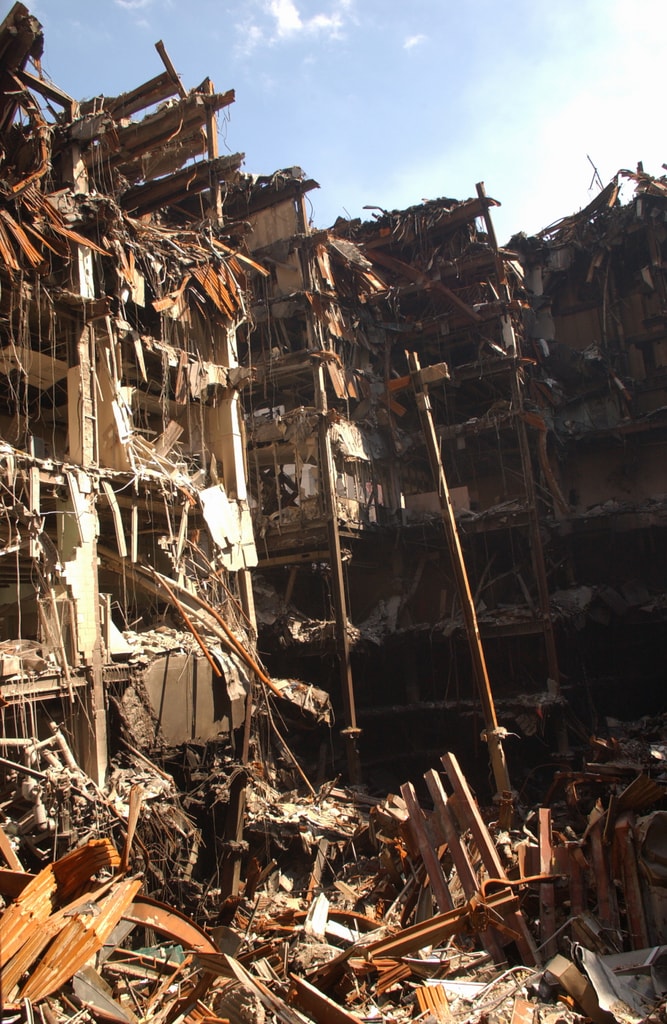 Figure 99. (9/27/01) Interior view of WTC 6 showing the clean cylindrical hole extending vertically through the building with minimal debris accumulation<br>- Photo by FEMA