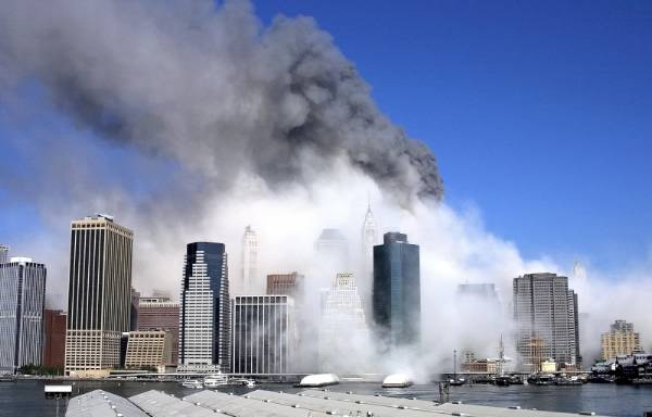 Figure 94. (9/11/01) Distant view showing streams of dark fumes and white dust flowing adjacent without homogenizing, demonstrating immiscibility anomaly