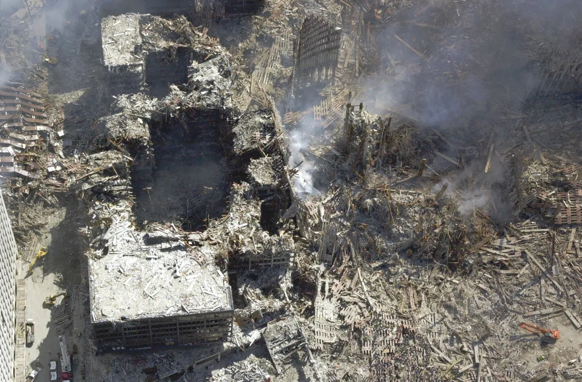 Figure 97. (9/15/2001) Close-up view of cylindrical holes in WTC 5 and WTC 6 showing clean vertical boring through reinforced concrete floors.<br>- Photo by NYC Office of Emergency Management