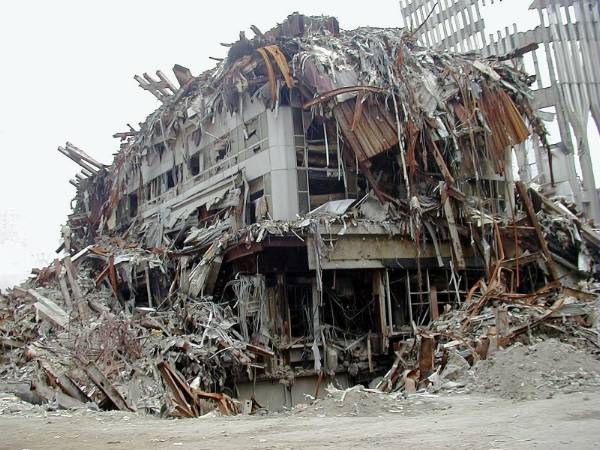 WTC 3 showing massive volumetric deficit where structural core has vanished, leaving minimal rubble pile inconsistent with original building mass