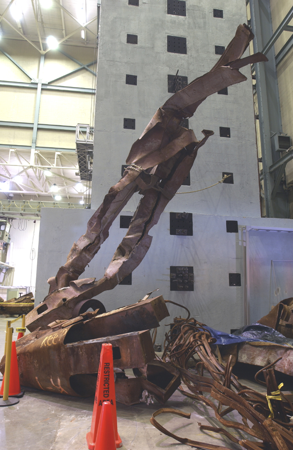 Figure 38. WTC beams (Perimeter column panels) WTC perimeter column assemblies wrapped into tight cylindrical spirals, showing smooth continuous curvature inconsistent with gravity collapse or conventional explosion.
<br>
- Image by NIST.