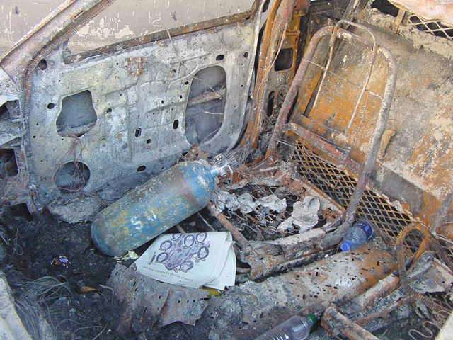 Figure 46. (9/13/01) Interior of NYPD Car 2723 showing steel transmission hump perforated with small holes, confirming internal resistive heating from conductive-loop coupling