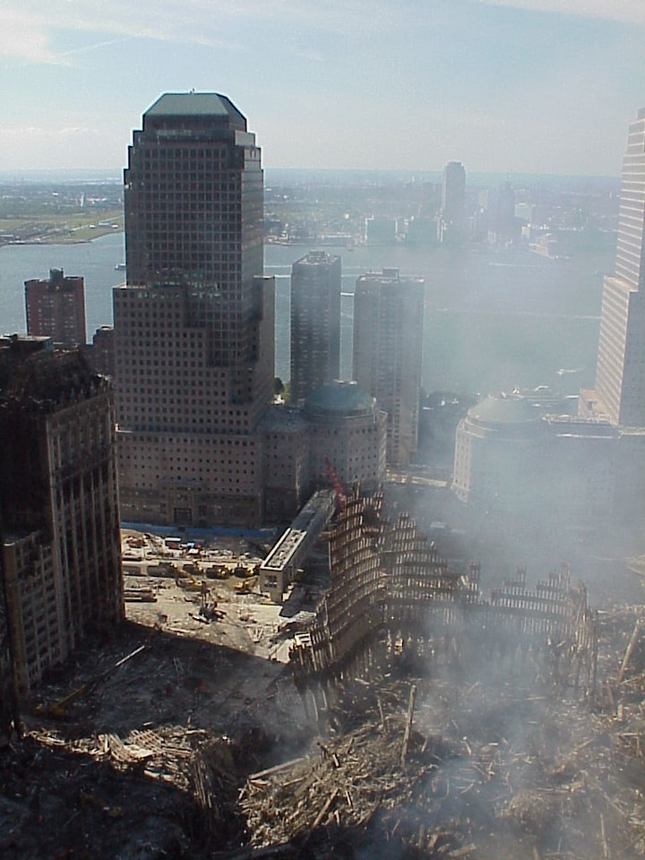 Figure 106. (9/13?/01) Deep empty holes under Liberty Street. Additional view of anomalous beam deformation at Liberty Street showing athermal plasticity and field-mediated softening