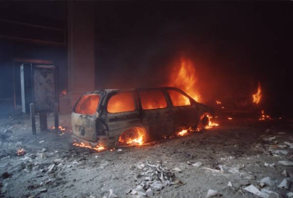 (9/11/01) Minivan consumed by flames while paper-covered ground around it remains untouched, demonstrating selective impedance heating