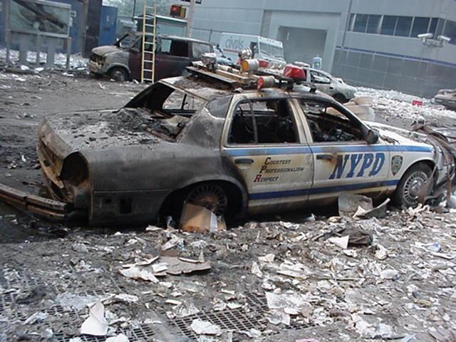 Figure 45. (9/11/01) Police car on West Broadway showing selective oxidation of conductive components while adjacent dielectrics remain intact, consistent with conductor-selective heating signatures in the West Broadway cluster
